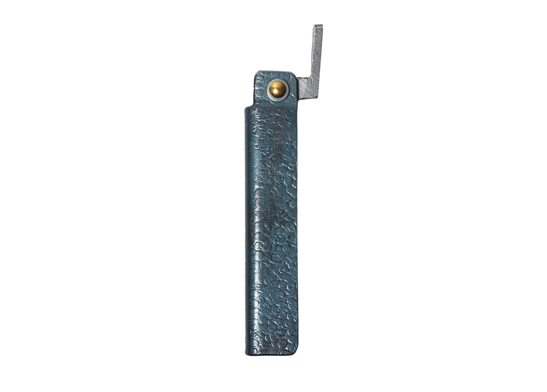 Profile view of the closed large Tomita Higo friction folder, highlighting the hand-forged black hammered iron handle and brass pivot.