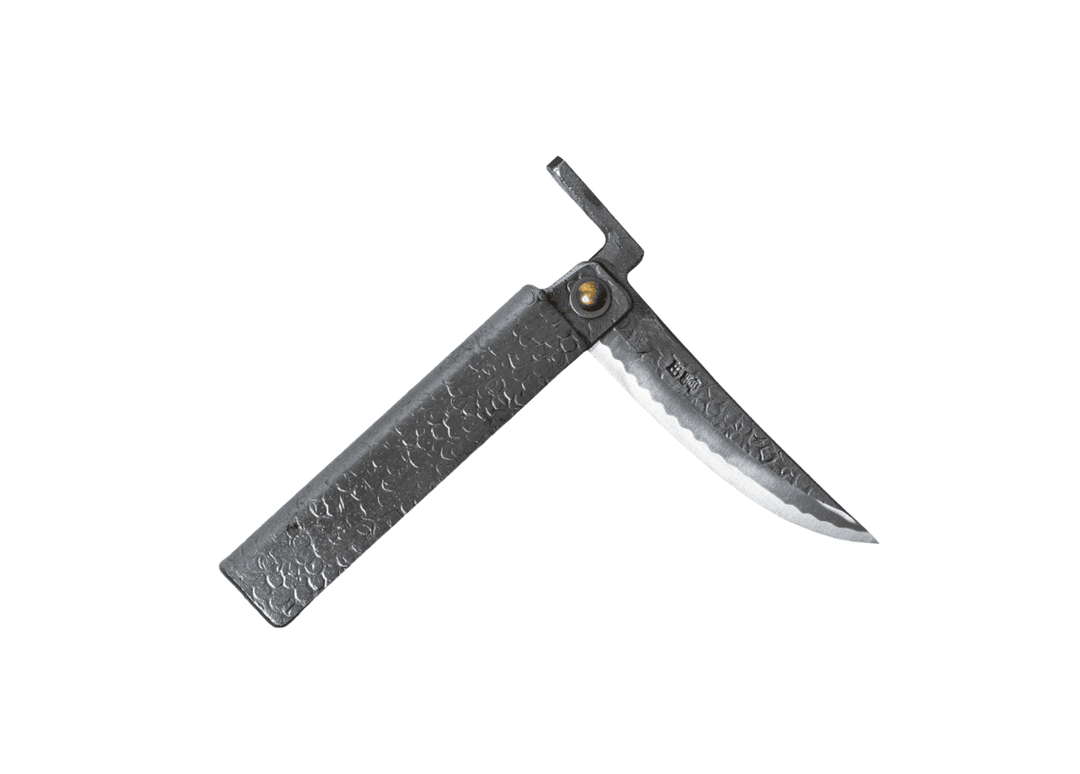Partially open Tomita Higo knife featuring a silver tsuchime hammered iron handle and a Shirogami steel Kengata blade with Midareba pattern.