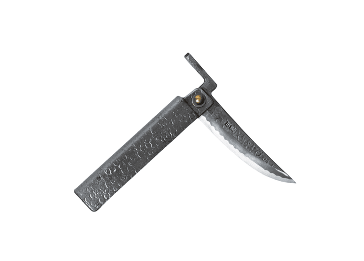 Partially open Tomita Higo knife featuring a silver tsuchime hammered iron handle and a Shirogami steel Kengata blade with Midareba pattern.
