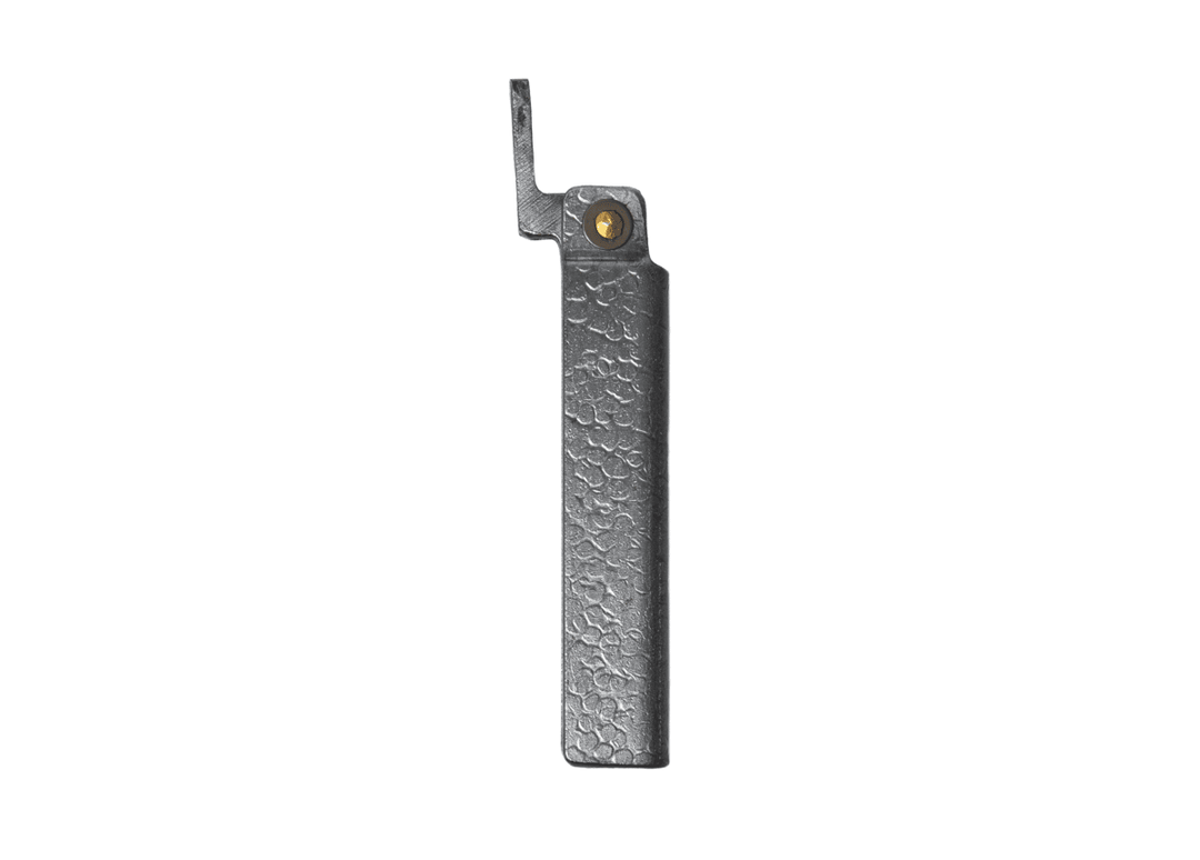Profile view of the closed Tomita Higo friction folder, highlighting the hand-forged silver hammered iron handle and brass pivot.