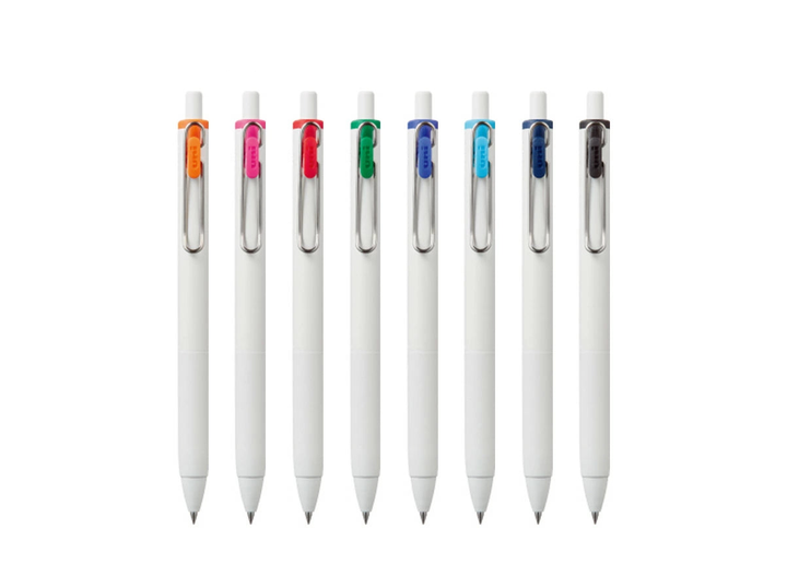 Lineup of eight Uni-ball One 0.38mm gel pens showing matte white bodies and color-coded wire clips.
