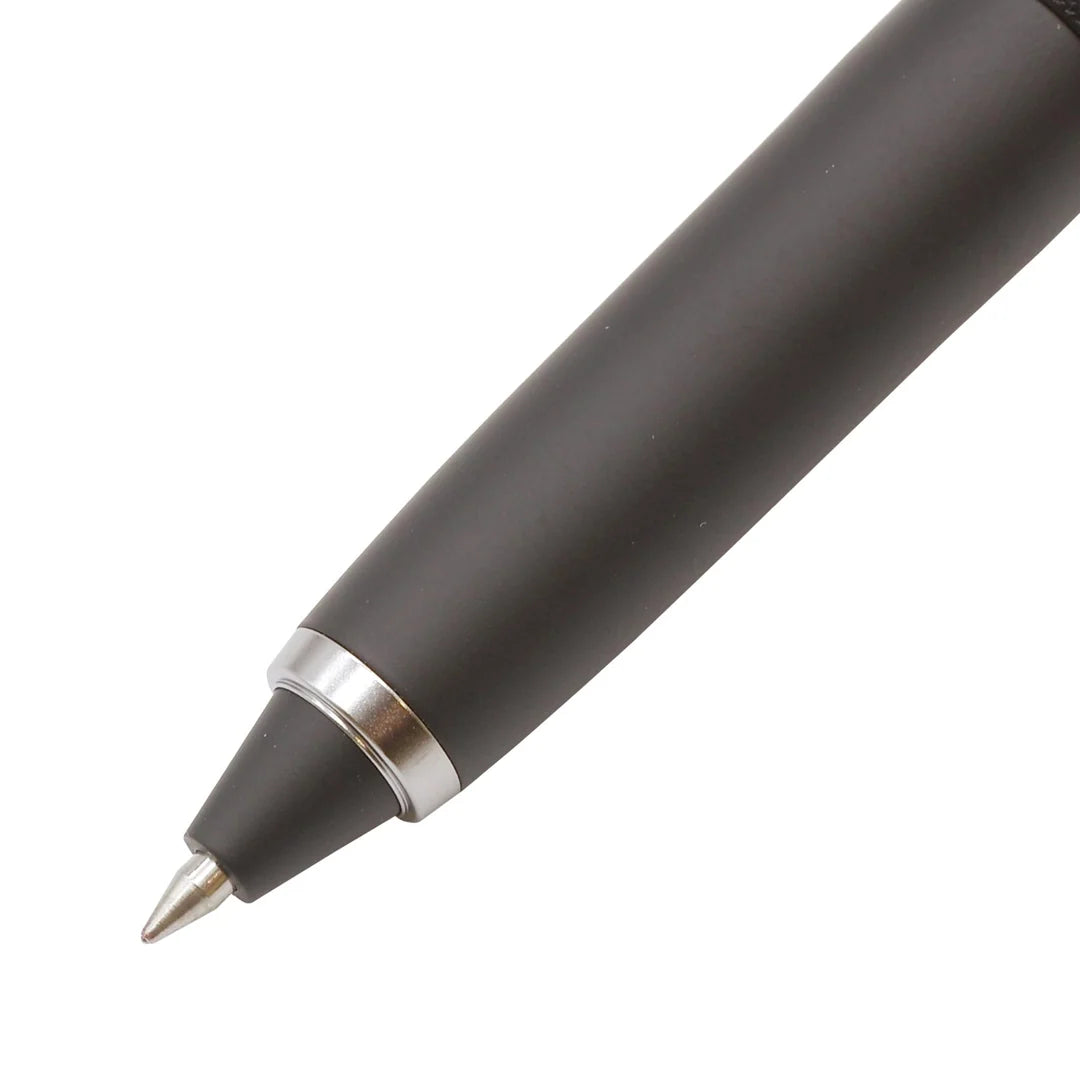 Close-up of the 0.5 mm tip and tapered black nose cone with silver ring on the Uni-ball ZENTO Signature 3-Colour ballpoint pen.