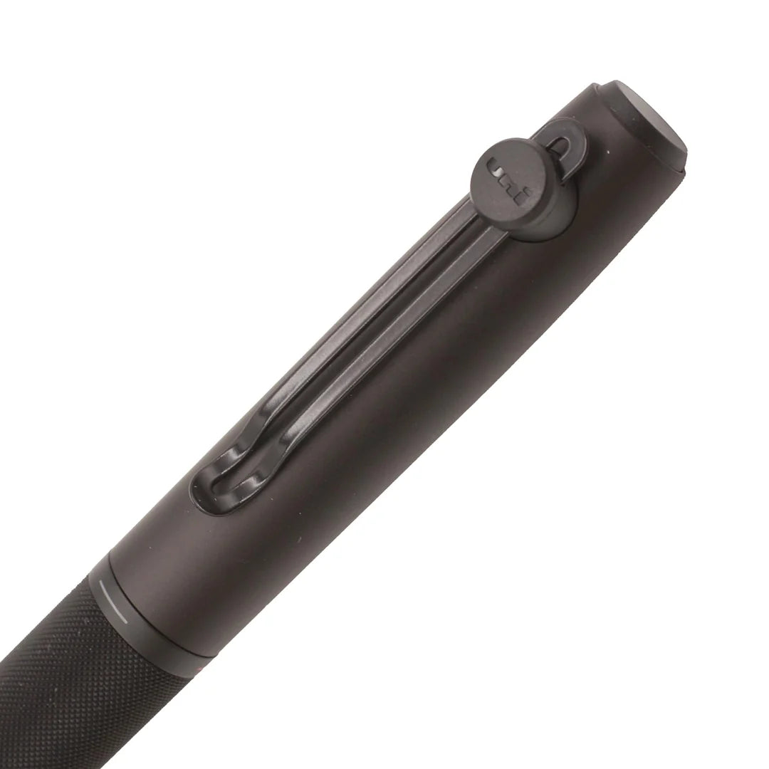Detail view of the Uni-ball ZENTO Signature magnetic cap, black metal pocket clip with round Uni emblem, and knurled selector ring.