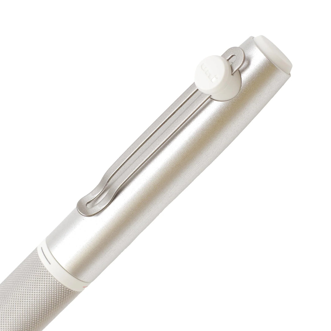 Detail view of the Uni-ball ZENTO Signature magnetic cap, metal pocket clip with white Uni logo, and knurled color-selector ring.
