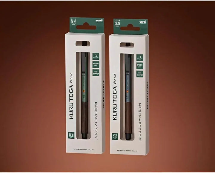 Official Japanese retail packaging for the Uni Kuru Toga Wood 0.5mm mechanical pencils in Forest Green and Steel Gray.