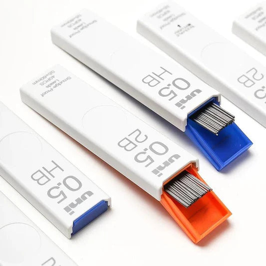 Close-up of open uni Smudge-Proof lead cases showing the graphite refills and sliding mechanism.