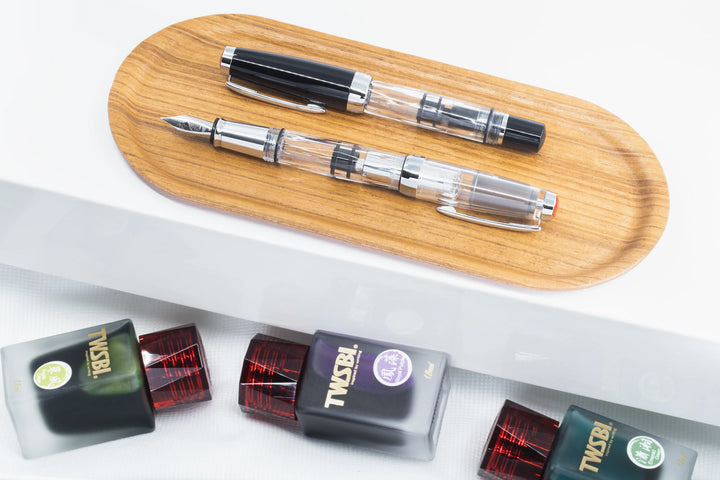 TWSBI Diamond Mini Fountain Pen – Classic on a wooden tray with ink cartridges below