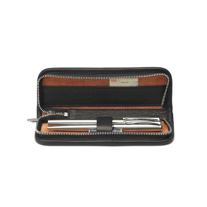 Interior of Black Sonnenleder Grass Leather Pen Case featuring 3 leather-covered loops holding silver pens and a tan leather accessory compartment.