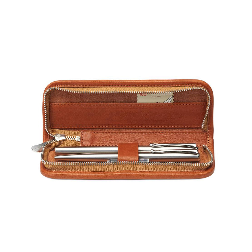 Interior of Sonnenleder Grass Leather Pen Case in Natural showing 3 leather-covered loops holding silver pens and a 14cm ruler compartment.
