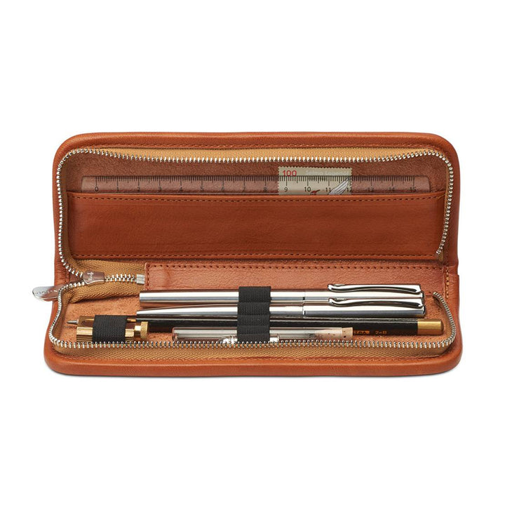 Interior view of the open Sonnenleder Kluge pencil case in Natural, showcasing 5 secure loops, eraser storage, and the dedicated leather compartment for a 17 cm ruler, stamps, and notes.
