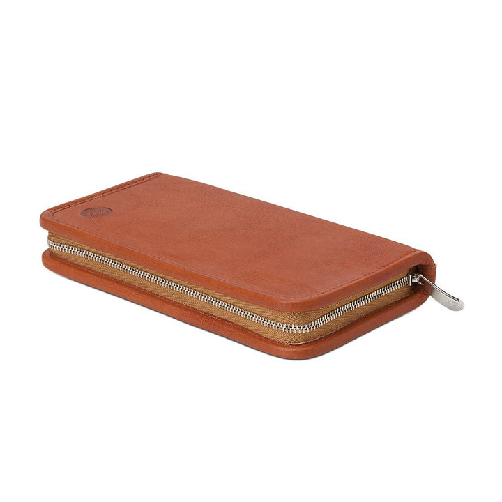 Angled profile of the closed Sonnenleder Novalis Leather Pencil Case in Natural, highlighting the 19cm wide-format design and premium polished metal zipper.