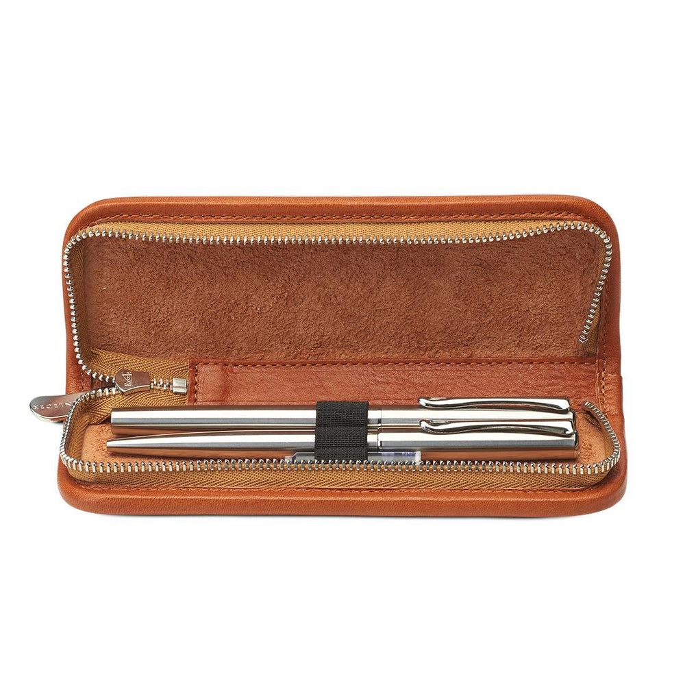 Interior view of the open Sonnenleder Richter pen case in Natural, showcasing the three leather-covered loops securing a fountain pen and rollerball in a slim layout.